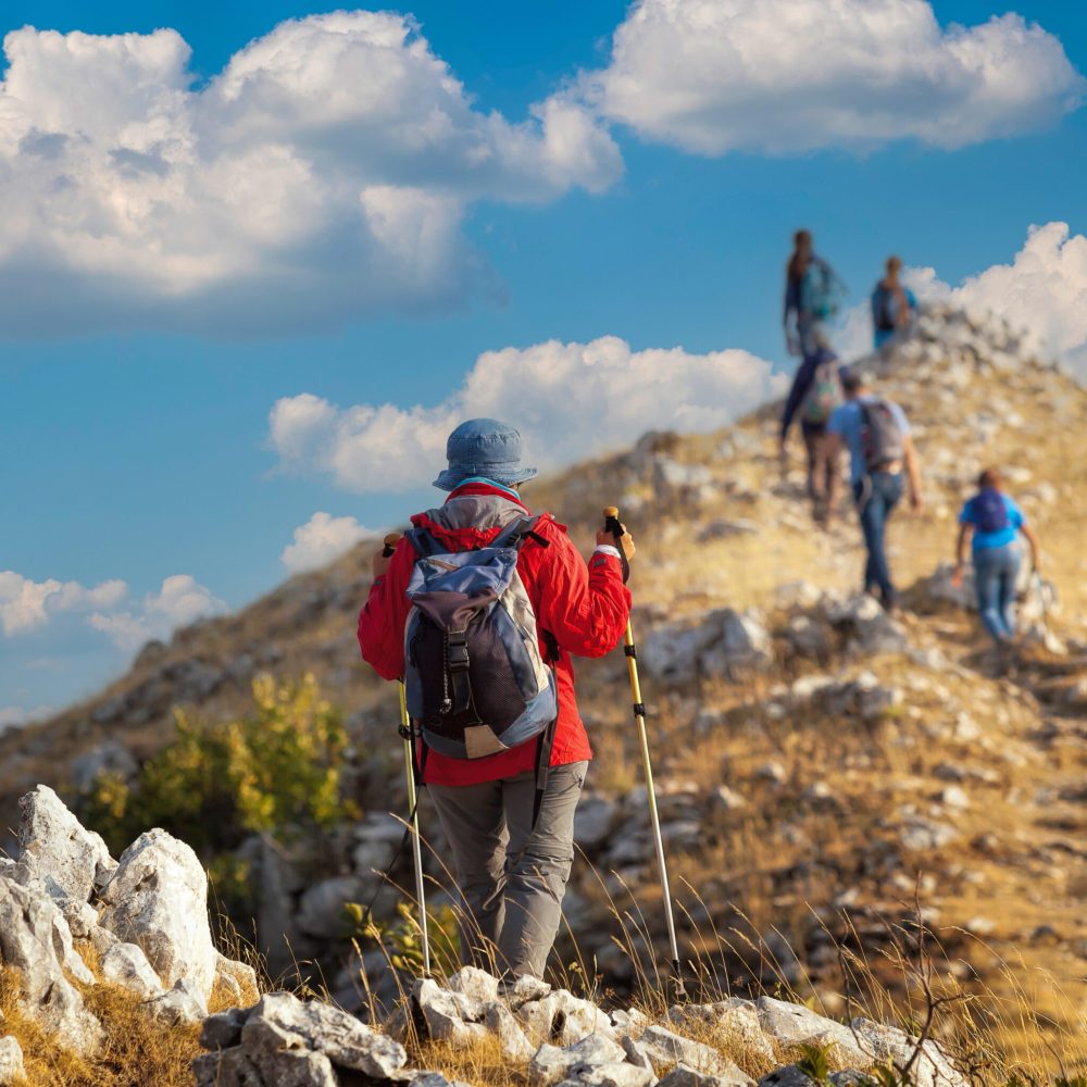 Pescasseroli (AQ), Italy - August 31, 2017: Group of hikers reach the top of the ridges of the mountains of Pescasseroli, near the Iorio Refuge.